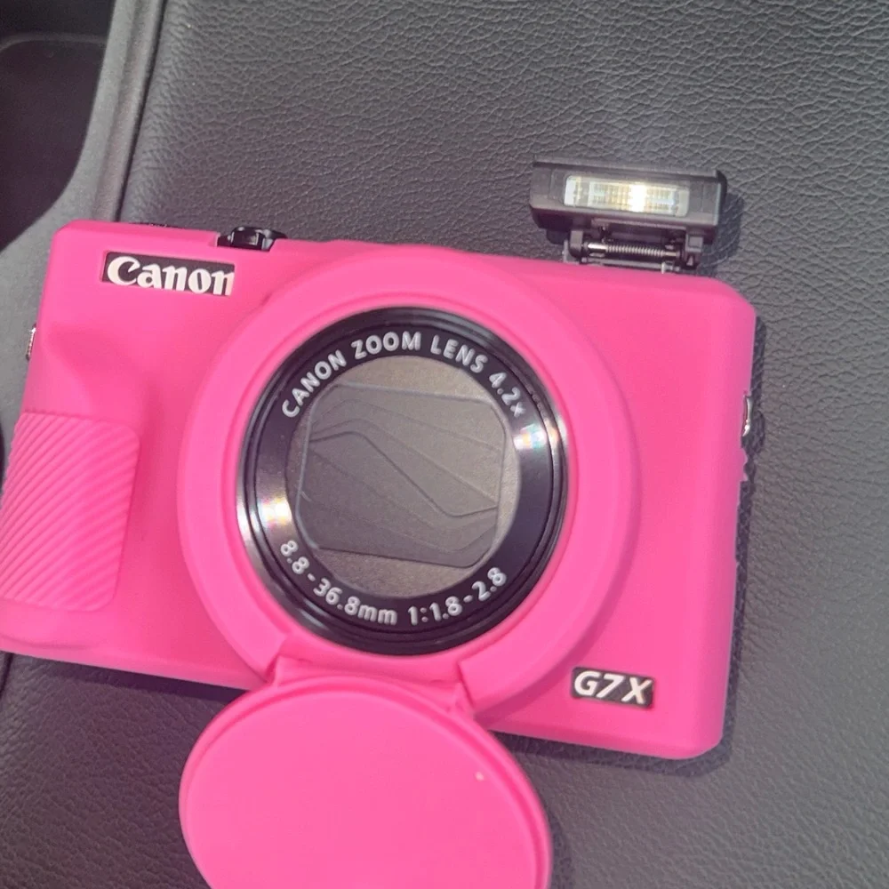 Canon G7X iii with pink cover and a black case